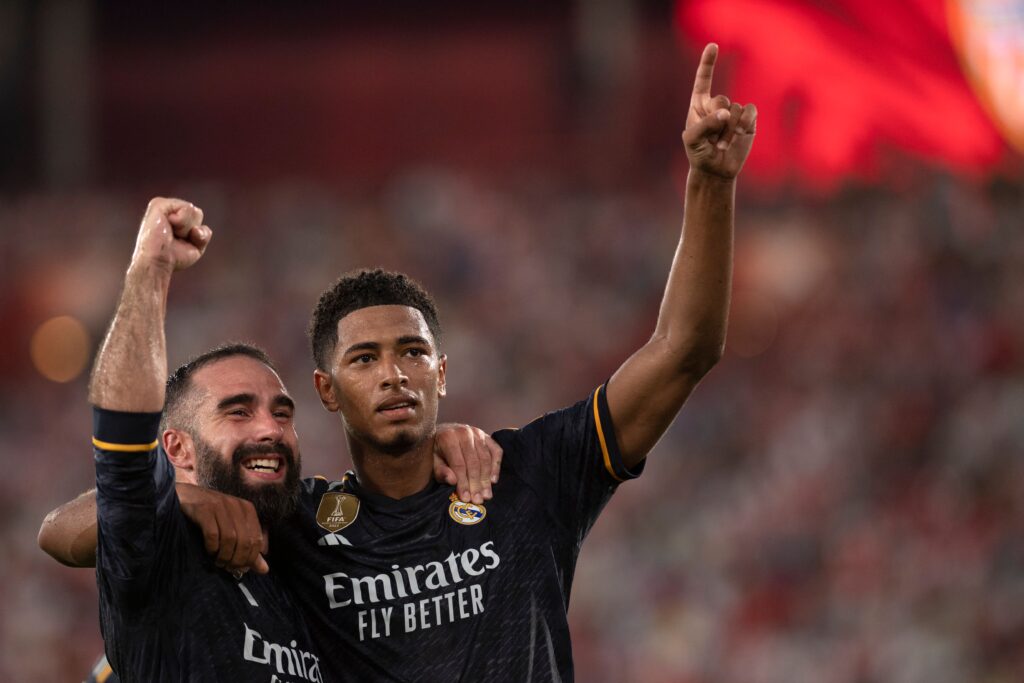 Real Madrid's English midfielder #05 Jude Bellingham celebrates scoring his second goal, with Real Madrid's Spanish defender #02 Dani Carvajal (L), during the Spanish Liga football match between UD Almeria and Real Madrid CF at the Municipal Stadium of the Mediterranean Games in Almeria on August 19, 2023.