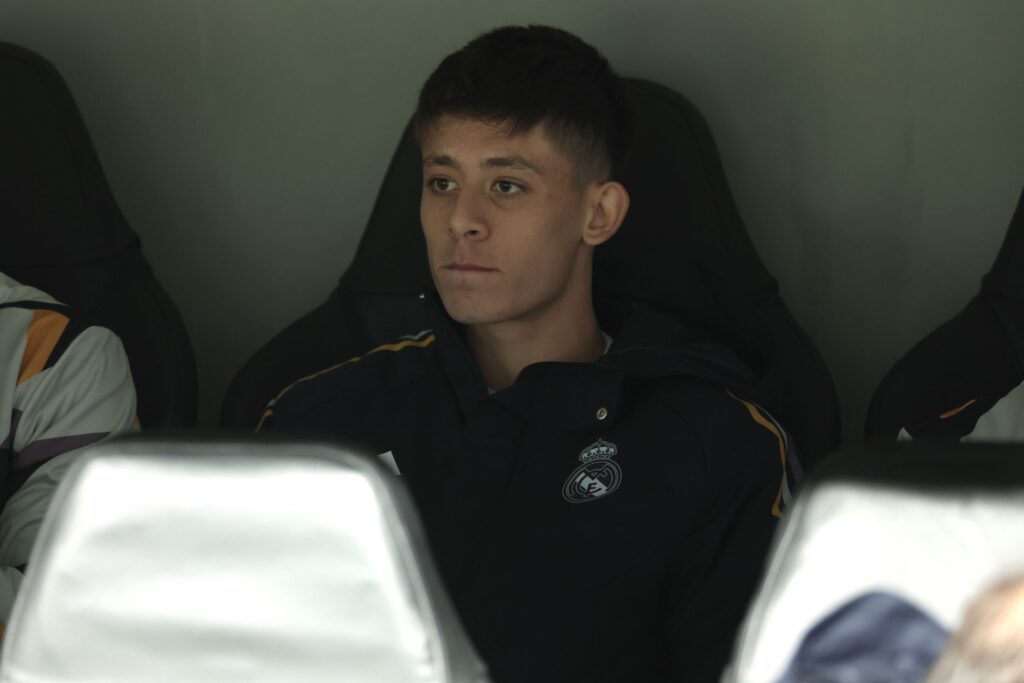 Real Madrid's Turkish midfielder #24 Arda Guler watches from the bench the UEFA Champions League group C football match between Real Madrid CF and SC Braga at the Santiago Bernabeu stadium in Madrid on November 8, 2023.