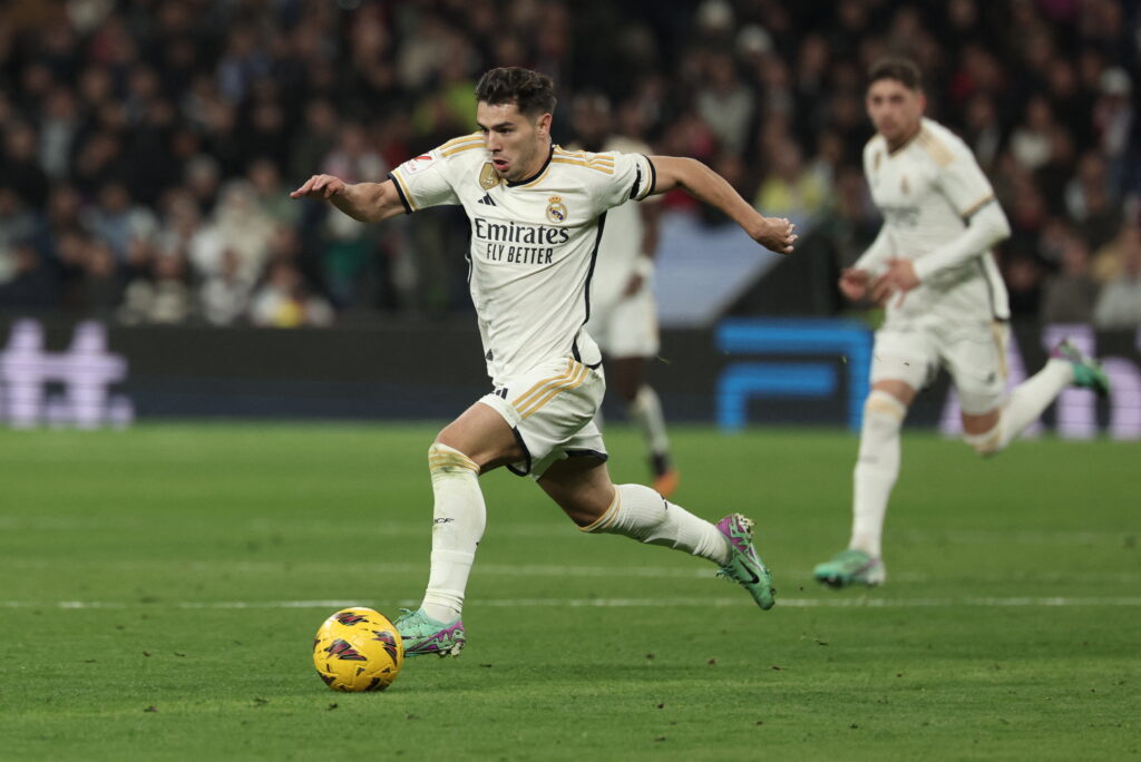 Real Madrid's Spanish forward #21 Brahim Diaz runs with the ball during the Spanish league football match between Real Madrid CF and Villarreal CF at the Santiago Bernabeu stadium in Madrid on December 17, 2023.