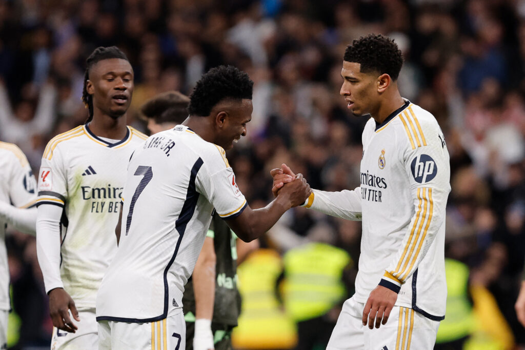 Real Madrid's English midfielder #5 Jude Bellingham celebrates with Real Madrid's Brazilian forward #07 Vinicius Junior during the Spanish league football match between Real Madrid CF and Girona FC at the Santiago Bernabeu stadium in Madrid on February 10, 2024.