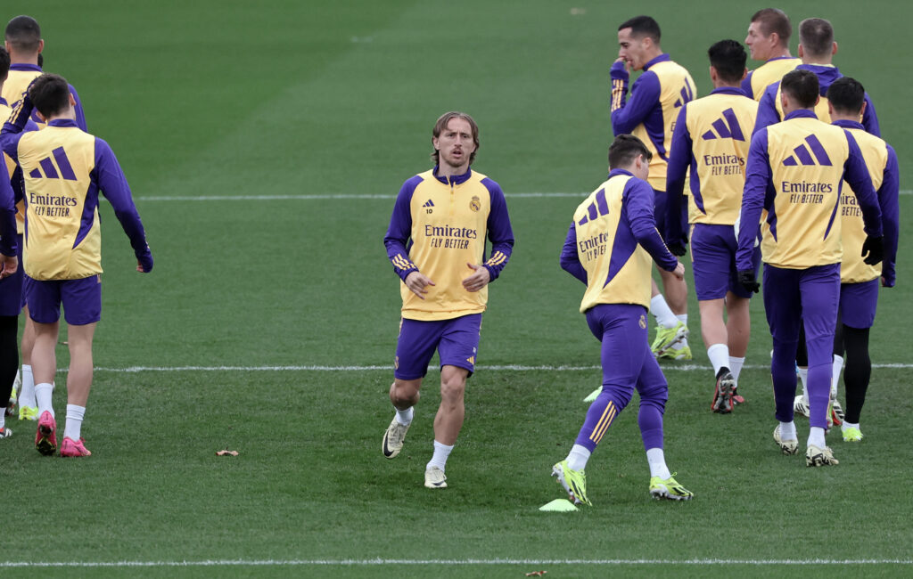 Real Madrid's Croatian midfielder #10 Luka Modric (R) and teammates attend a training session at the Ciudad Real Madrid training ground in Valdebebas, outskirts of Madrid, on February 9, 2024 on the eve of their La Liga football match against Girona FC.