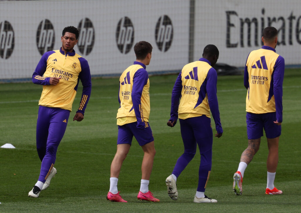 Real Madrid's English midfielder #5 Jude Bellingham (L) and teammates attend a training session at Valdebebas Sport City in Madrid, on March 30, 2024.