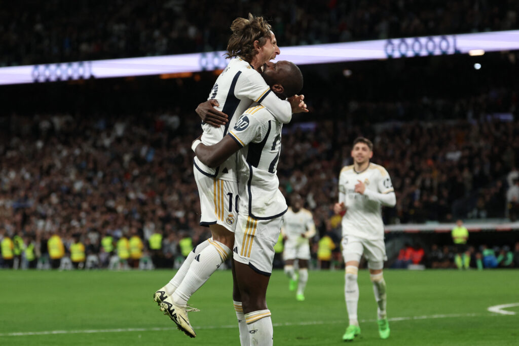 Real Madrid's Croatian midfielder #10 Luka Modric (L) and Real Madrid's German defender #22 Antonio Rudiger react to Celta's owngoal during the Spanish league football match between Real Madrid CF and RC Celta de Vigo at the Santiago Bernabeu stadium in Madrid on March 10, 2024.