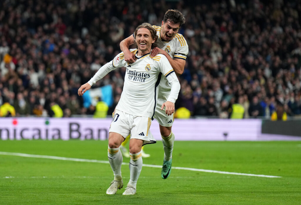 MADRID, SPAIN - DECEMBER 17: Luka Modric of Real Madrid celebrates with teammate Brahim Diaz after scoring the team's fourth goal during the LaLiga EA Sports match between Real Madrid CF and Villarreal CF at Estadio Santiago Bernabeu on December 17, 2023 in Madrid, Spain.