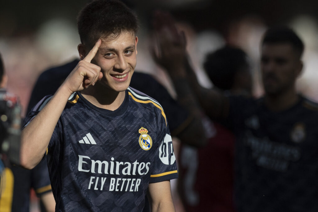 Real Madrid's Turkish midfielder #24 Arda Guler celebrates after scoring during the Spanish League football match between Granada FC and Real Madrid CF at Nuevo Los Carmenes stadium in Granada on May 11, 2024.