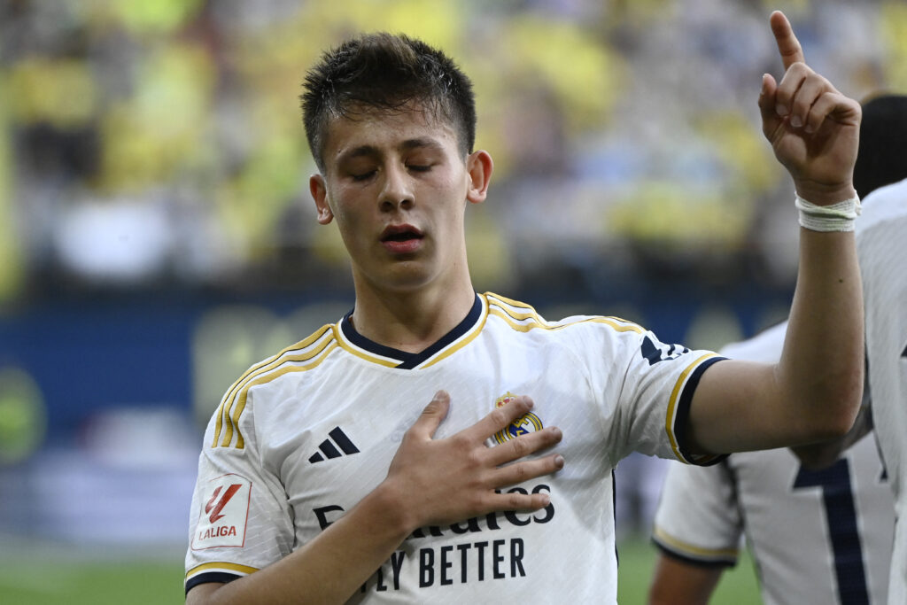 Real Madrid's Turkish midfielder #24 Arda Guler celebrates scoring his team's second goal during the Spanish League football match between Villarreal CF and Real Madrid CF at La Ceramica stadium in Vila-real on May 19, 2024.