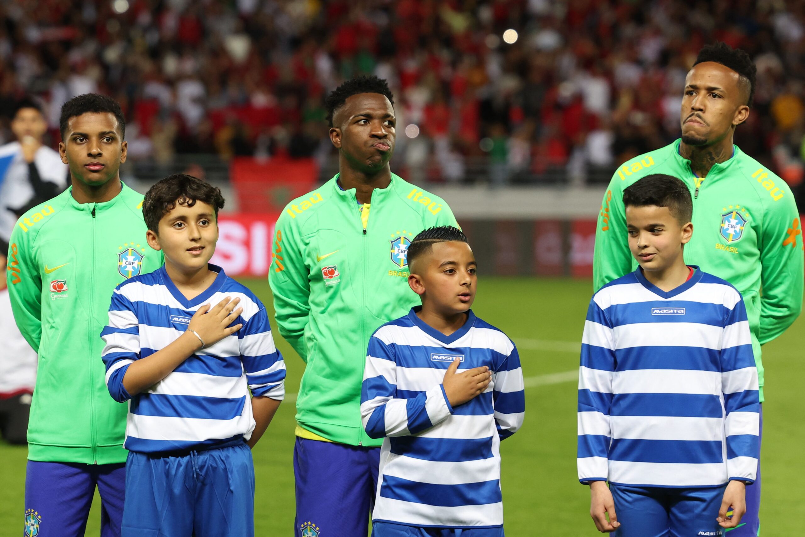 (L to R) Brazil's forwards Rodrygo, Vinicius Junior and defender Eder Militao pose for a picture ahead of a friendly football match between Morocco and Brazil at the Ibn Batouta Stadium in Tangier on March 26, 2023.