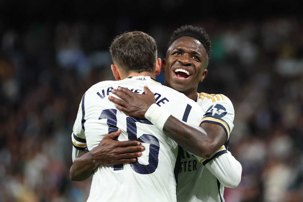 MADRID, SPAIN - MAY 14: Vinicius Junior of Real Madrid celebrates with Federico Valverde of Real Madrid after he scores the teams third goal during the LaLiga EA Sports match between Real Madrid CF and Deportivo Alaves at Estadio Santiago Bernabeu on May 14, 2024 in Madrid, Spain.