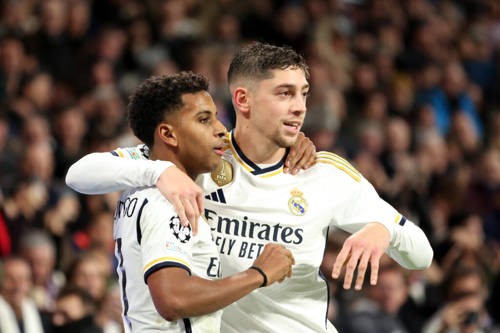 MADRID, SPAIN - NOVEMBER 08: Rodrygo of Real Madrid (L) celebrates after scoring the team's third goal with teammate Federico Valverde during the UEFA Champions League match between Real Madrid and SC Braga at Estadio Santiago Bernabeu on November 08, 2023 in Madrid, Spain.