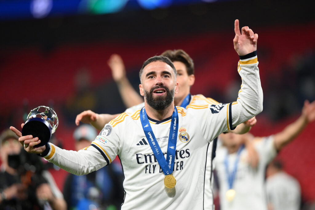 LONDON, ENGLAND - JUNE 01: Daniel Carvajal of Real Madrid celebrates victory with his PlayStation Player of the Match award after Real Madrid defeat Borussia Dortmund during the UEFA Champions League 2023/24 Final match between Borussia Dortmund and Real Madrid CF at Wembley Stadium on June 01, 2024 in London, England.