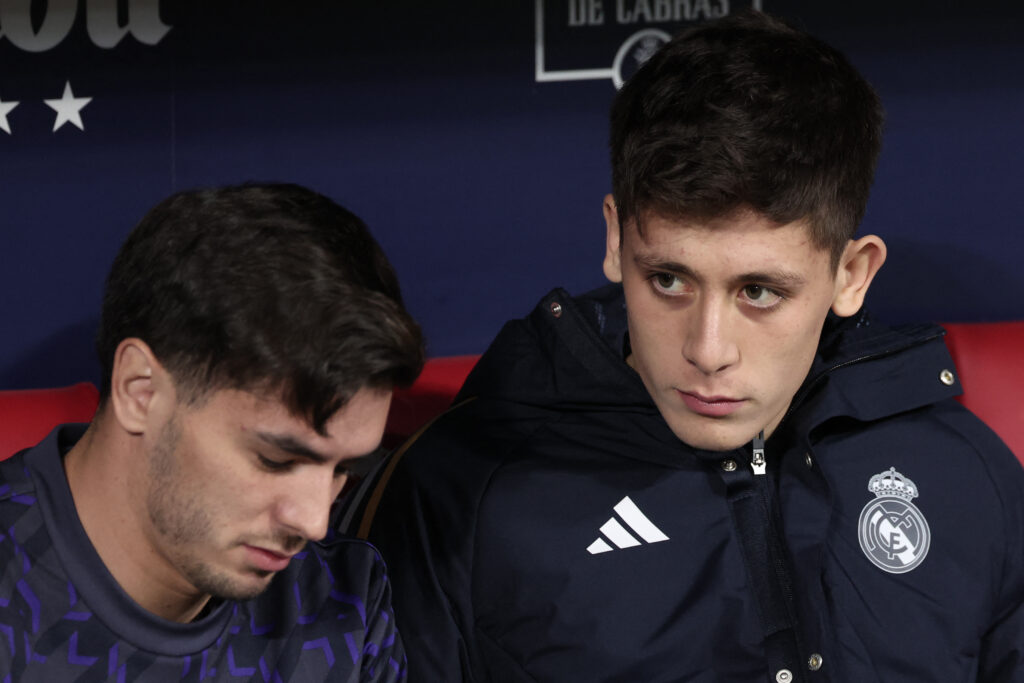 Real Madrid's Turkish midfielder #24 Arda Guler (R) sits on the bench next to Real Madrid's Spanish forward #21 Brahim Diaz during the Spanish Copa del Rey (King's Cup) football match between Club Atletico de Madrid and Real Madrid CF at the Metropolitano stadium in Madrid on January 18, 2024.