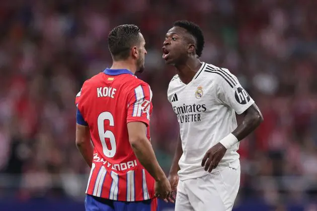 MADRID, SPAIN - SEPTEMBER 29: Vinicius Junior (R) of Real Madrid CF argues with Koke (L) of Atletico de Madrid during the LaLiga match between Atletico de Madrid and Real Madrid CF at Estadio Civitas Metropolitano on September 29, 2024 in Madrid, Spain.