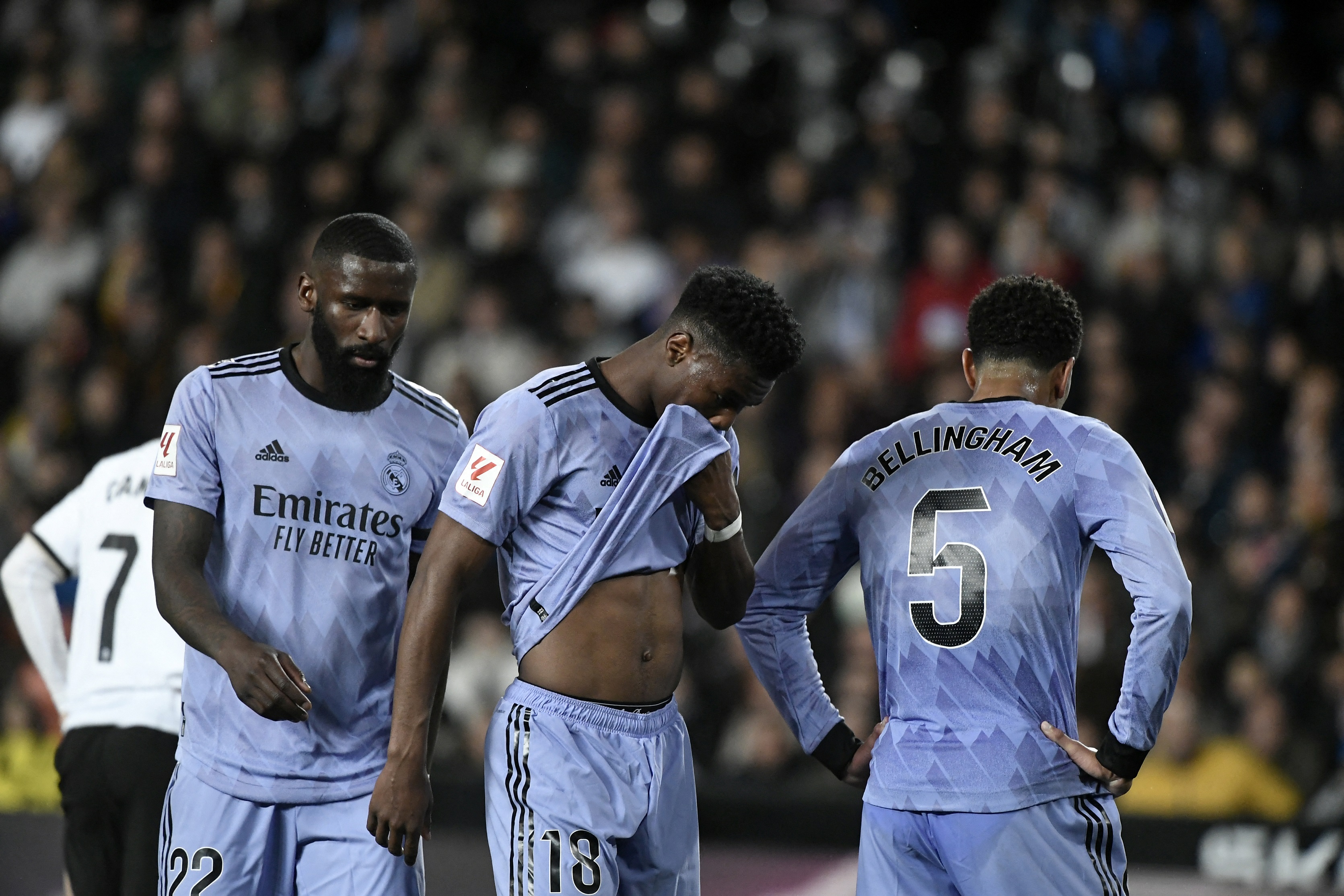 Real Madrid's German defender #22 Antonio Rudige, Real Madrid's French defender #18 Aurelien Tchouameni and Real Madrid's English midfielder #5 Jude Bellingham react during the Spanish league football match between Valencia CF and Real Madrid at the Mestalla stadium in Valencia on March 2, 2024.