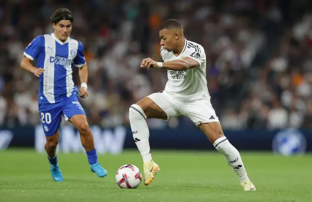 MADRID, SPAIN - SEPTEMBER 24: Kylian Mbappe of Real Madrid runs with the ball during the LaLiga match between Real Madrid CF and Deportivo Alaves at Estadio Santiago Bernabeu on September 24, 2024 in Madrid, Spain.