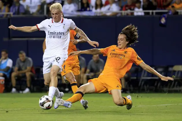 CHICAGO, ILLINOIS - JULY 31: Alejandro Jimenez of AC Milan is challenged by Joan Martinez Lozano of Real Madrid during a Pre-Season Friendly match between AC Milan and Real Madrid at Soldier Field Stadium on July 31, 2024 in Chicago, Illinois.