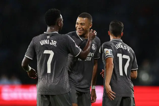 VIGO, SPAIN - OCTOBER 19: Kylian Mbappe of Real Madrid celebrates scoring his team's first goal with teammate Vinicius Junior during the LaLiga match between RC Celta de Vigo and Real Madrid CF at Estadio de Balaidos on October 19, 2024 in Vigo, Spain.