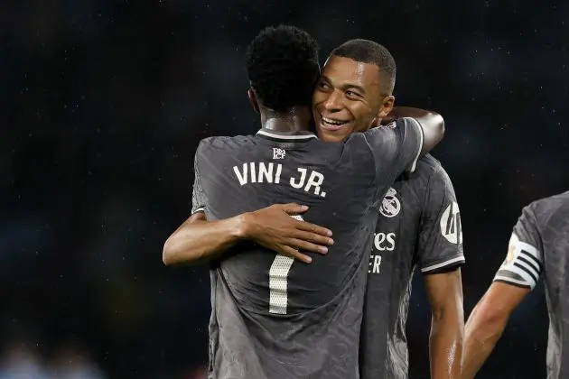 VIGO, SPAIN - OCTOBER 19: Kylian Mbappe of Real Madrid celebrates scoring his team's first goal with teammate Vinicius Junior during the LaLiga match between RC Celta de Vigo and Real Madrid CF at Estadio Balaidos on October 19, 2024 in Vigo, Spain.