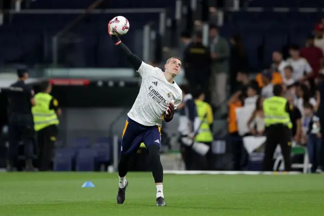 MADRID, SPAIN - SEPTEMBER 24: Goalkeeper Andriy Lunin of Real Madrid CF warms up before the LaLiga match between Real Madrid CF and Deportivo Alaves at Estadio Santiago Bernabeu on September 24, 2024 in Madrid, Spain.