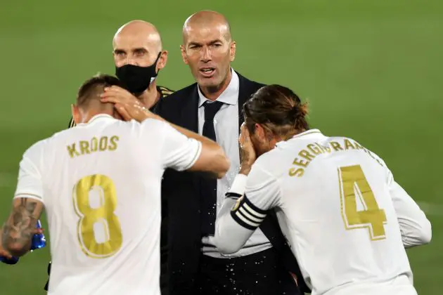 MADRID, SPAIN - JULY 02: Head coach Zinedine Zidane of Real Madrid talks to Toni Kroos and Sergio Ramos during the Liga match between Real Madrid CF and Getafe CF at Estadio Alfredo Di Stefano on July 02, 2020 in Madrid, Spain. Football Stadiums around Europe remain empty due to the Coronavirus Pandemic as Government social distancing laws prohibit fans inside venues resulting in all fixtures being played behind closed doors.