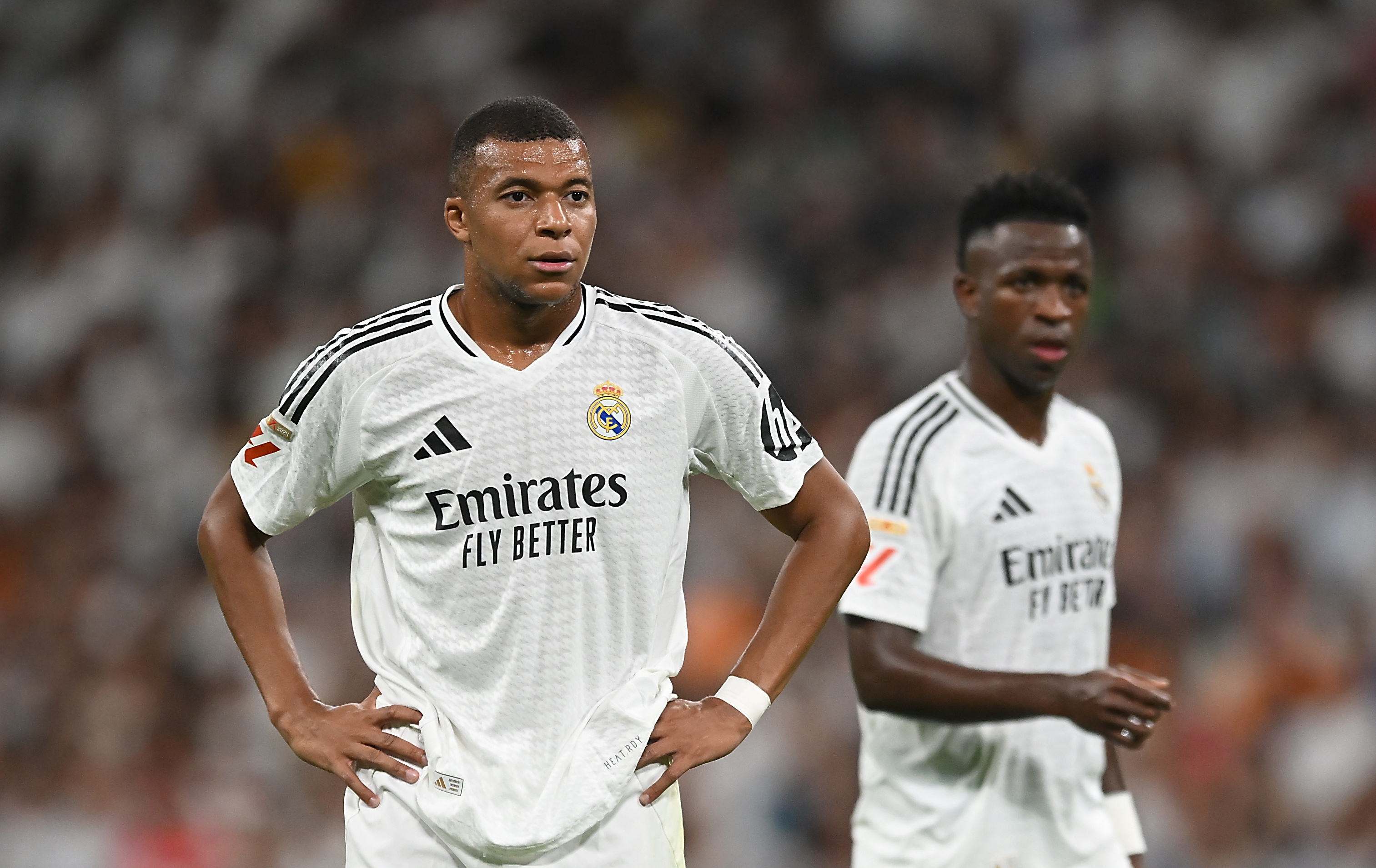 MADRID, SPAIN - SEPTEMBER 01: Kylian Mbappe of Real Madrid looks on with teammate Vinicius Junior during the LaLiga match between Real Madrid CF and Real Betis Balompie at Estadio Santiago Bernabeu on September 01, 2024 in Madrid, Spain.