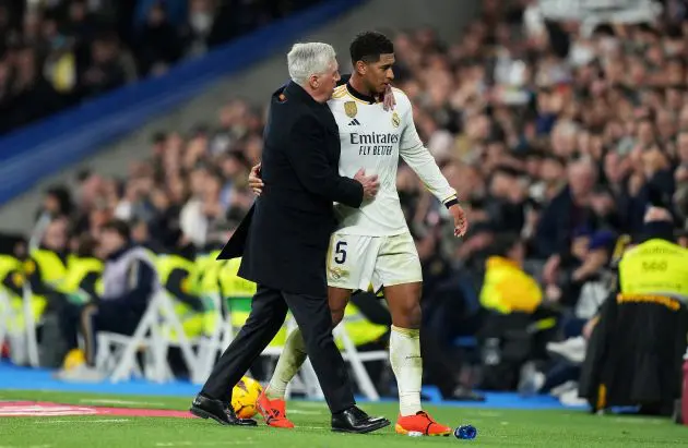 MADRID, SPAIN - DECEMBER 17: Jude Bellingham of Real Madrid interacts with Carlo Ancelotti, Head Coach of Real Madrid, as he is substituted off during the LaLiga EA Sports match between Real Madrid CF and Villarreal CF at Estadio Santiago Bernabeu on December 17, 2023 in Madrid, Spain.