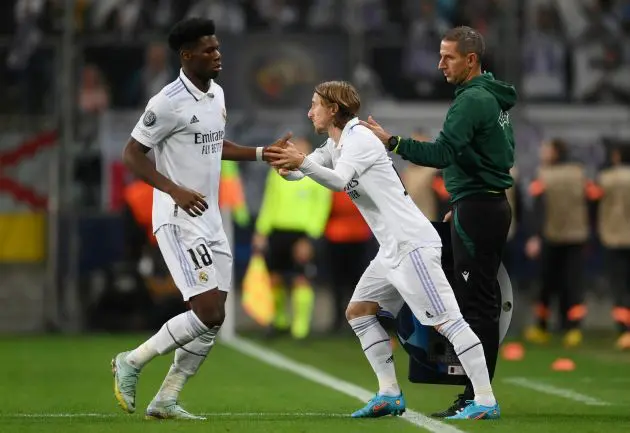 WARSAW, POLAND - OCTOBER 11: Aurelien Tchouameni of Real Madrid interacts with Luka Modric of Real Madrid after being substituted during the UEFA Champions League group F match between Shakhtar Donetsk and Real Madrid at Wojska Polskiego Stadium on October 11, 2022 in Warsaw, Poland.