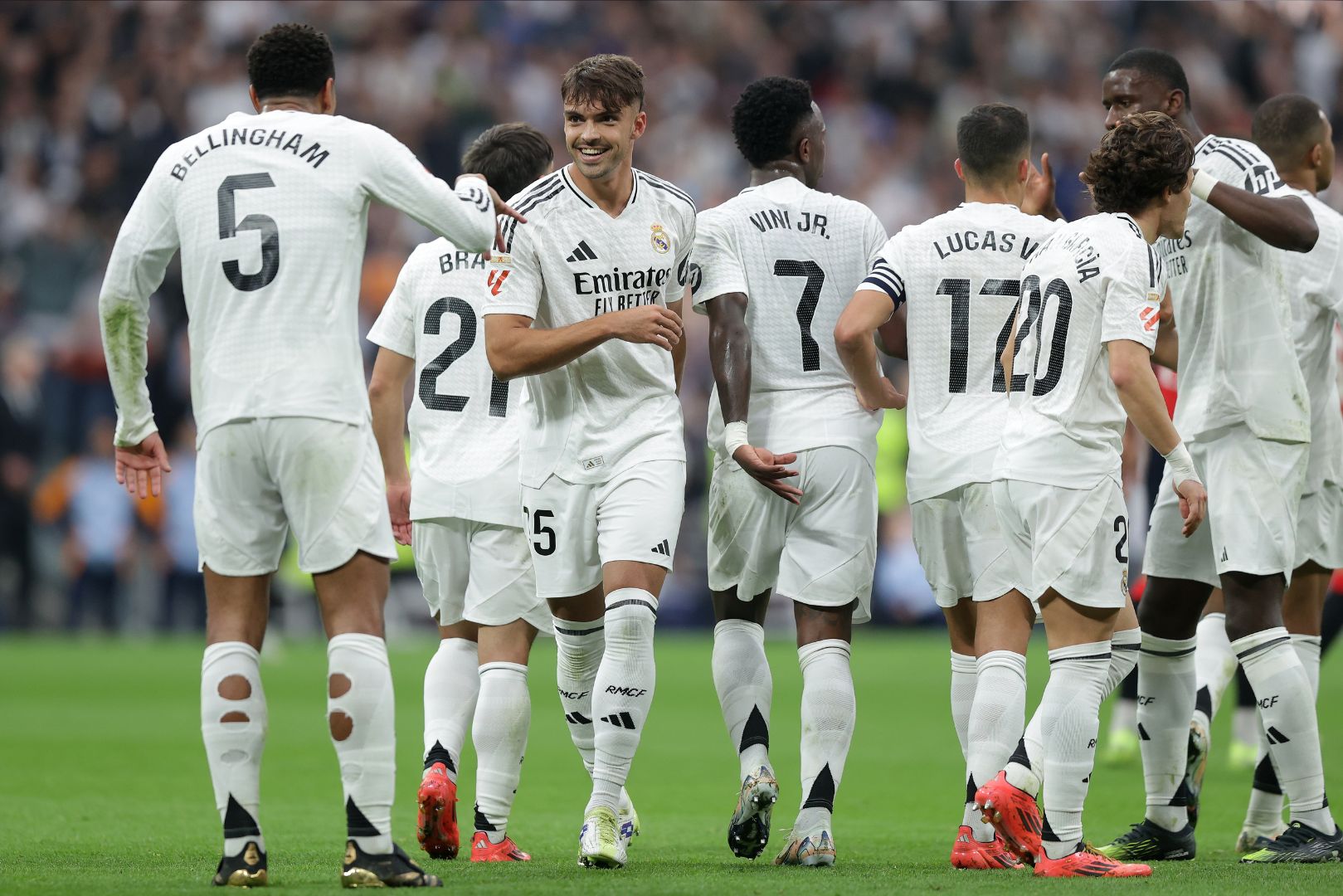 MADRID, SPAIN - NOVEMBER 09: Jude Bellingham (L) of Real Madrid CF celebrates scoring their second goal with teammate Raul Asencio (2ndL) during the LaLiga match between Real Madrid CF and CA Osasuna at Estadio Santiago Bernabeu on November 09, 2024 in Madrid, Spain.
