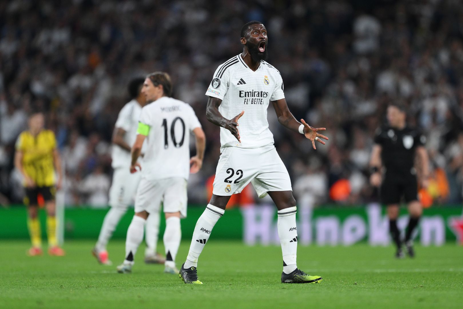 MADRID, SPAIN - OCTOBER 22: Antonio Ruediger of Real Madrid celebrates after teammate Vinicius Junior (not pictured) scores his team's second goal during the UEFA Champions League 2024/25 League Phase MD3 match between Real Madrid C.F. and Borussia Dortmund at Estadio Santiago Bernabeu on October 22, 2024 in Madrid, Spain.