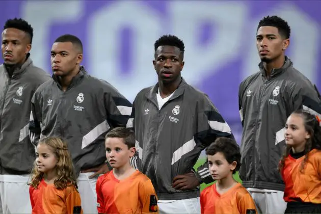 MADRID, SPAIN - OCTOBER 22: Eder Militao, Kylian Mbappe, Vinicius Junior and Jude Bellingham of Real Madrid watch on prior to the UEFA Champions League 2024/25 League Phase MD3 match between Real Madrid C.F. and Borussia Dortmund at Estadio Santiago Bernabeu on October 22, 2024 in Madrid, Spain.