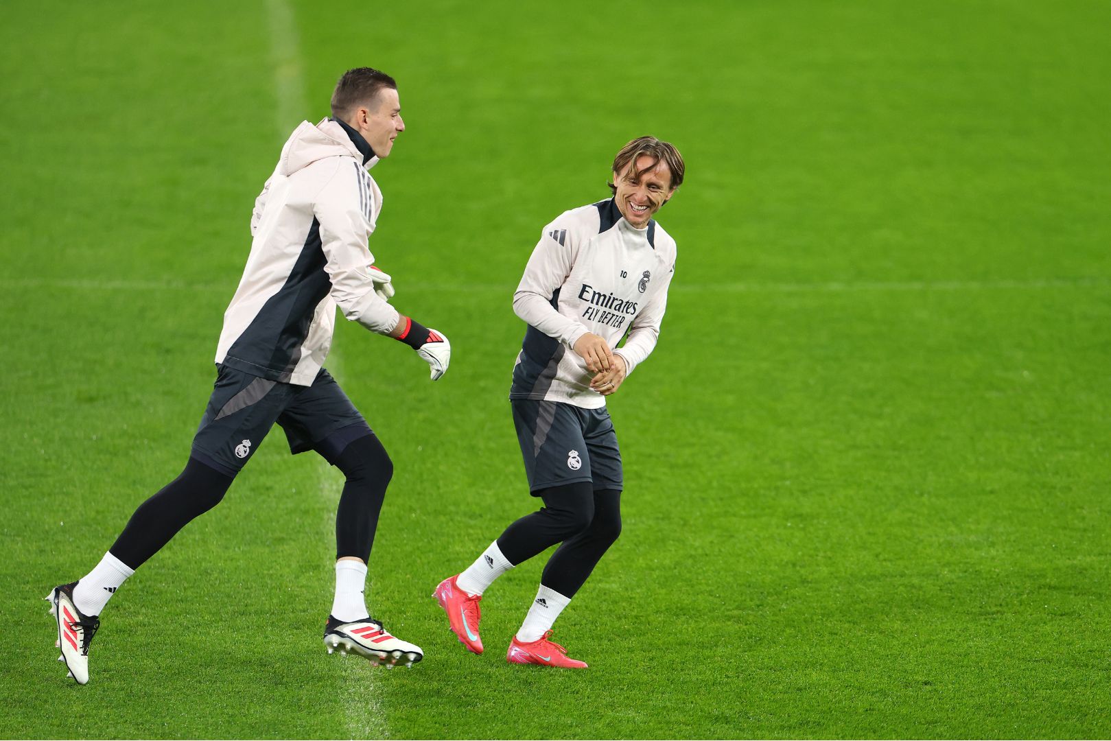 MANCHESTER, ENGLAND - FEBRUARY 10: Andriy Lunin and Luka Modric of Real Madrid during a training session during the UEFA Champions League 2024/25 League Knockout Play-off first Leg Training And Press Conference at Manchester City Stadium on February 10, 2025 in Manchester, England.