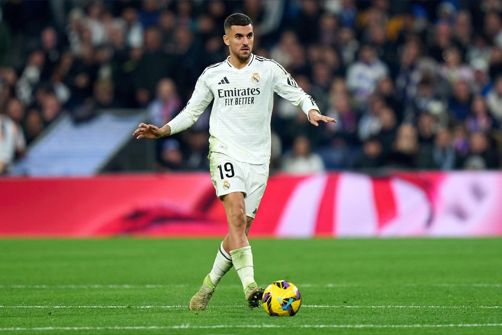 MADRID, SPAIN - FEBRUARY 08: Dani Ceballos of Real Madrid controls the ball during the LaLiga match between Real Madrid CF and Atletico de Madrid at Estadio Santiago Bernabeu on February 08, 2025 in Madrid, Spain.