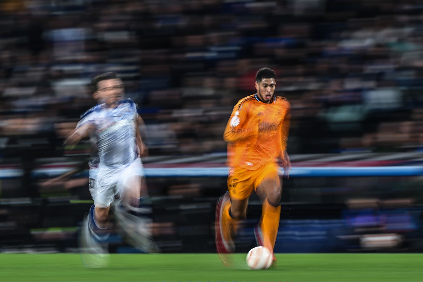 SAN SEBASTIAN, SPAIN - FEBRUARY 26: Jude Bellingham of Real Madrid runs with the ball during the Copa del Rey Semi Final match between Real Sociedad and Real Madrid at Reale Arena on February 26, 2025 in San Sebastian, Spain.