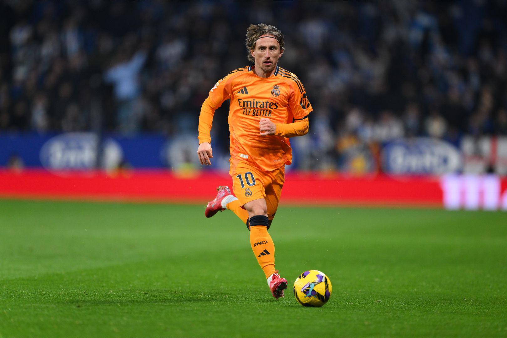 BARCELONA, SPAIN - FEBRUARY 01: Luka Modrić of Real Madrid runs with the ball during the LaLiga match between RCD Espanyol de Barcelona and Real Madrid CF at RCDE Stadium on February 01, 2025 in Barcelona, Spain.