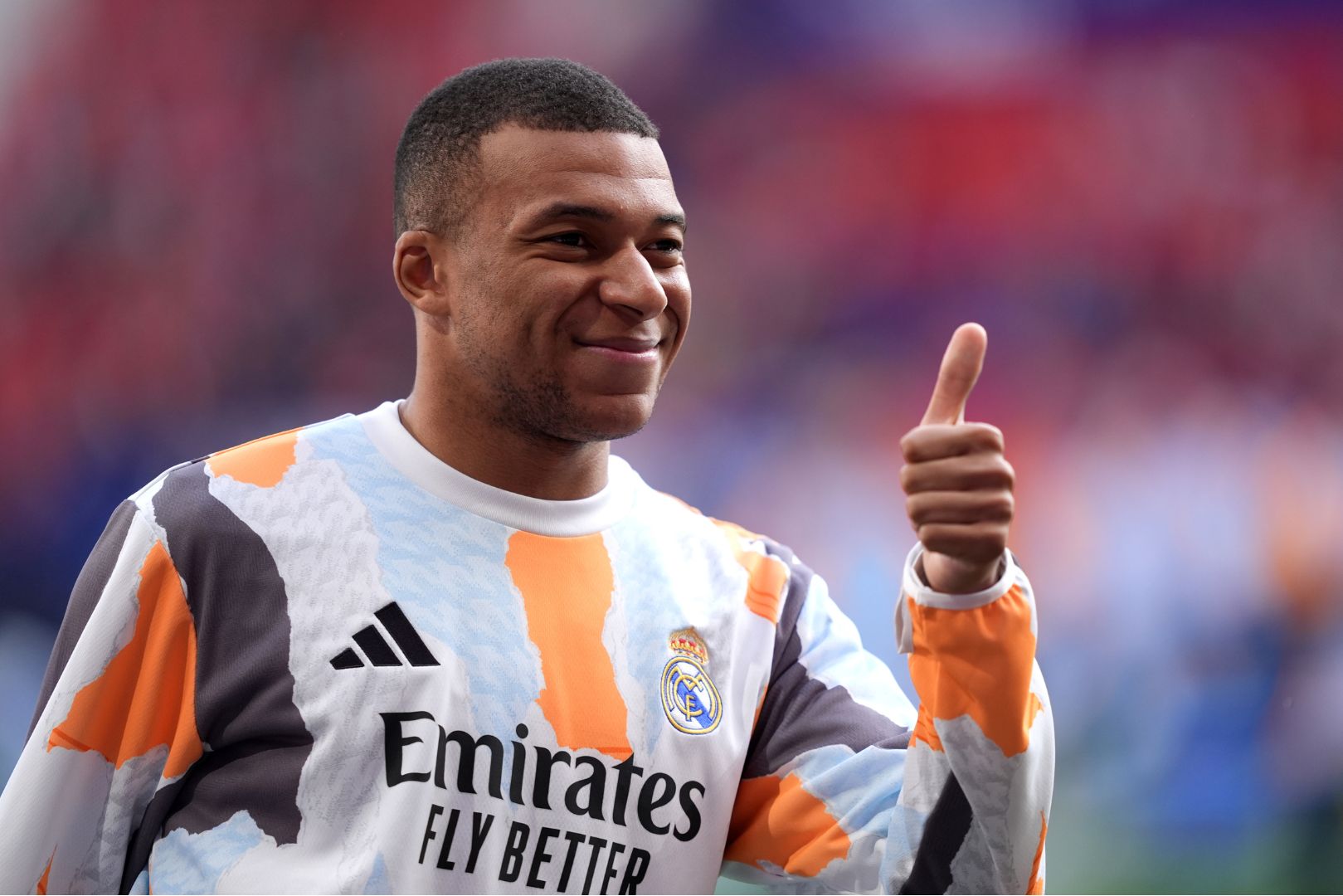 PAMPLONA, SPAIN - FEBRUARY 15: Kylian Mbappe of Real Madrid gives a thumbs up prior to the LaLiga match between CA Osasuna and Real Madrid CF at Estadio El Sadar on February 15, 2025 in Pamplona, Spain.
