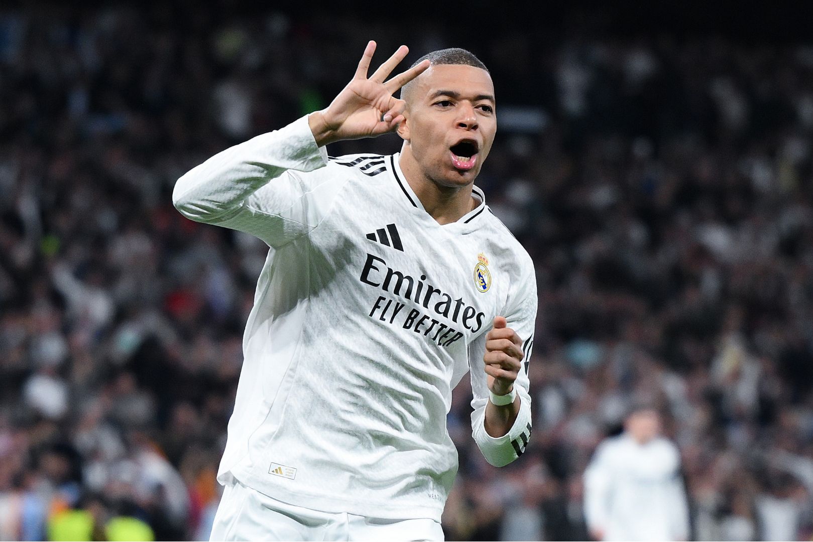 MADRID, SPAIN - FEBRUARY 19: Kylian Mbappe of Real Madrid celebrates scoring his team's third goal and his hat trick during the UEFA Champions League 2024/25 League Knockout Play-off second leg match between Real Madrid C.F. and Manchester City at Santiago Bernabeu Stadium on February 19, 2025 in Madrid, Spain.