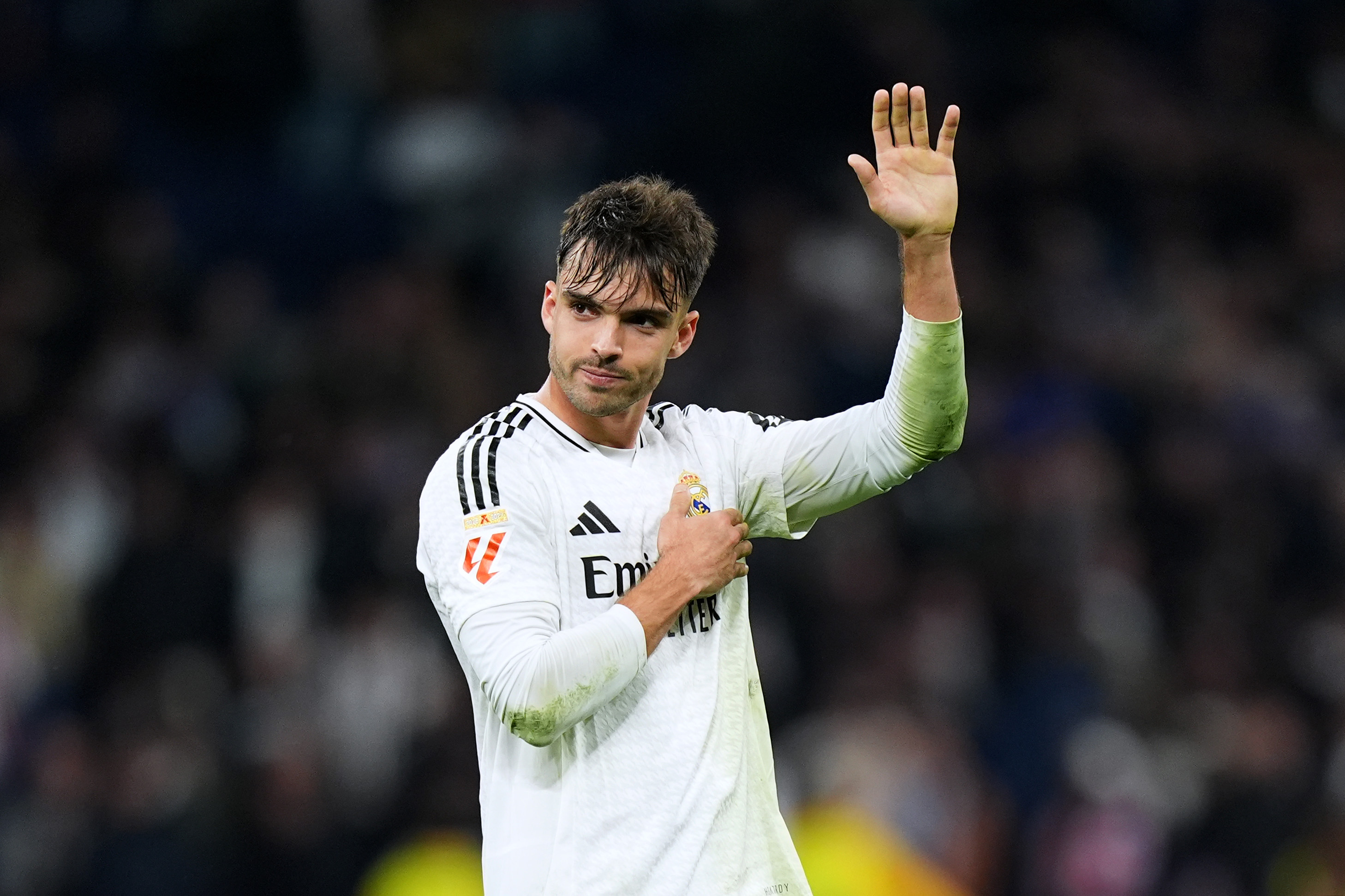 MADRID, SPAIN - FEBRUARY 08: Raul Asencio of Real Madrid acknowledges the fans after the LaLiga match between Real Madrid CF and Atletico de Madrid at Estadio Santiago Bernabeu on February 08, 2025 in Madrid, Spain.