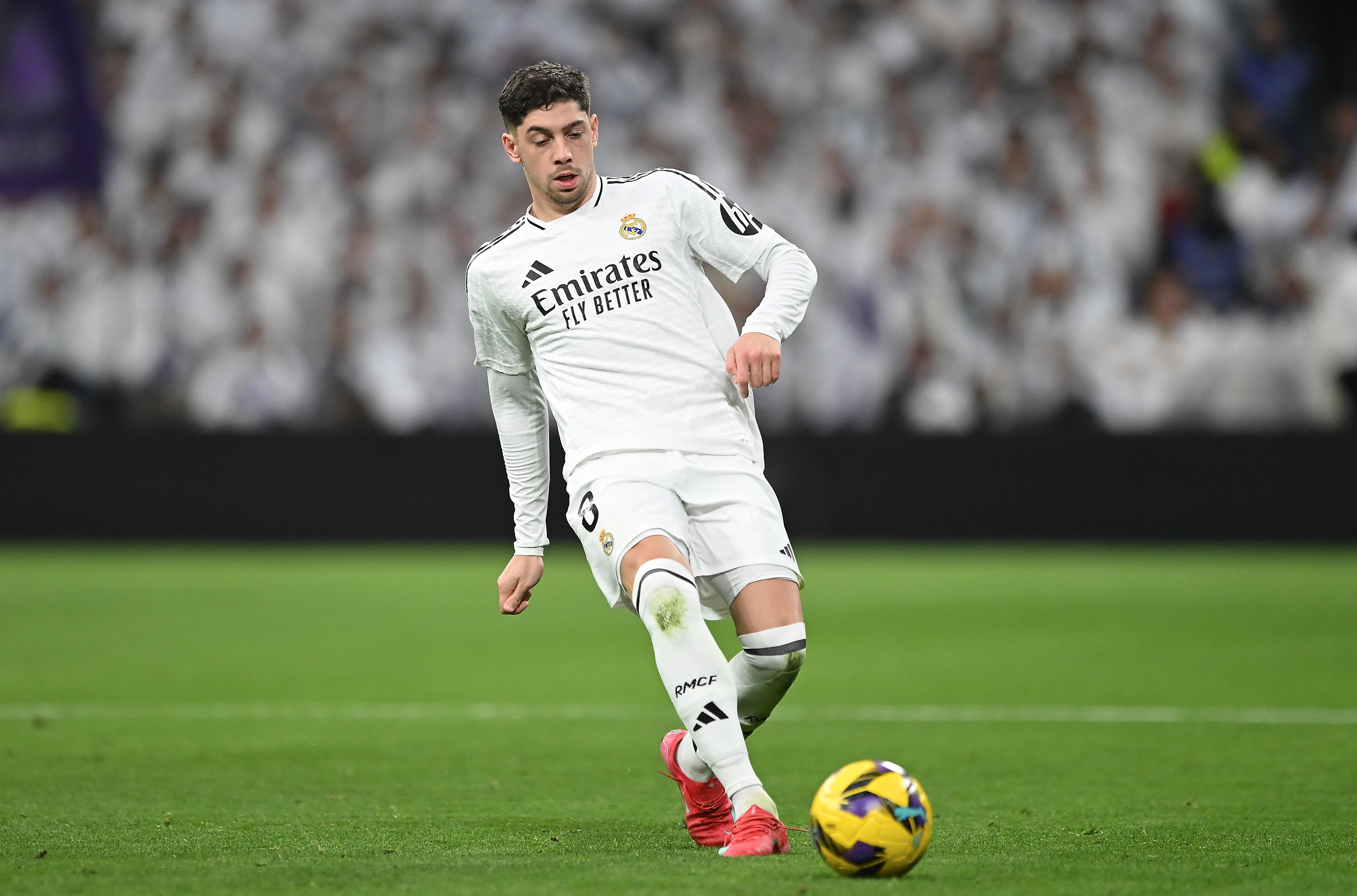 MADRID, SPAIN - JANUARY 19: Federico Valverde of Real Madrid passes thje ball during the LaLiga match between Real Madrid CF and UD Las Palmas at Estadio Santiago Bernabeu on January 19, 2025 in Madrid, Spain.