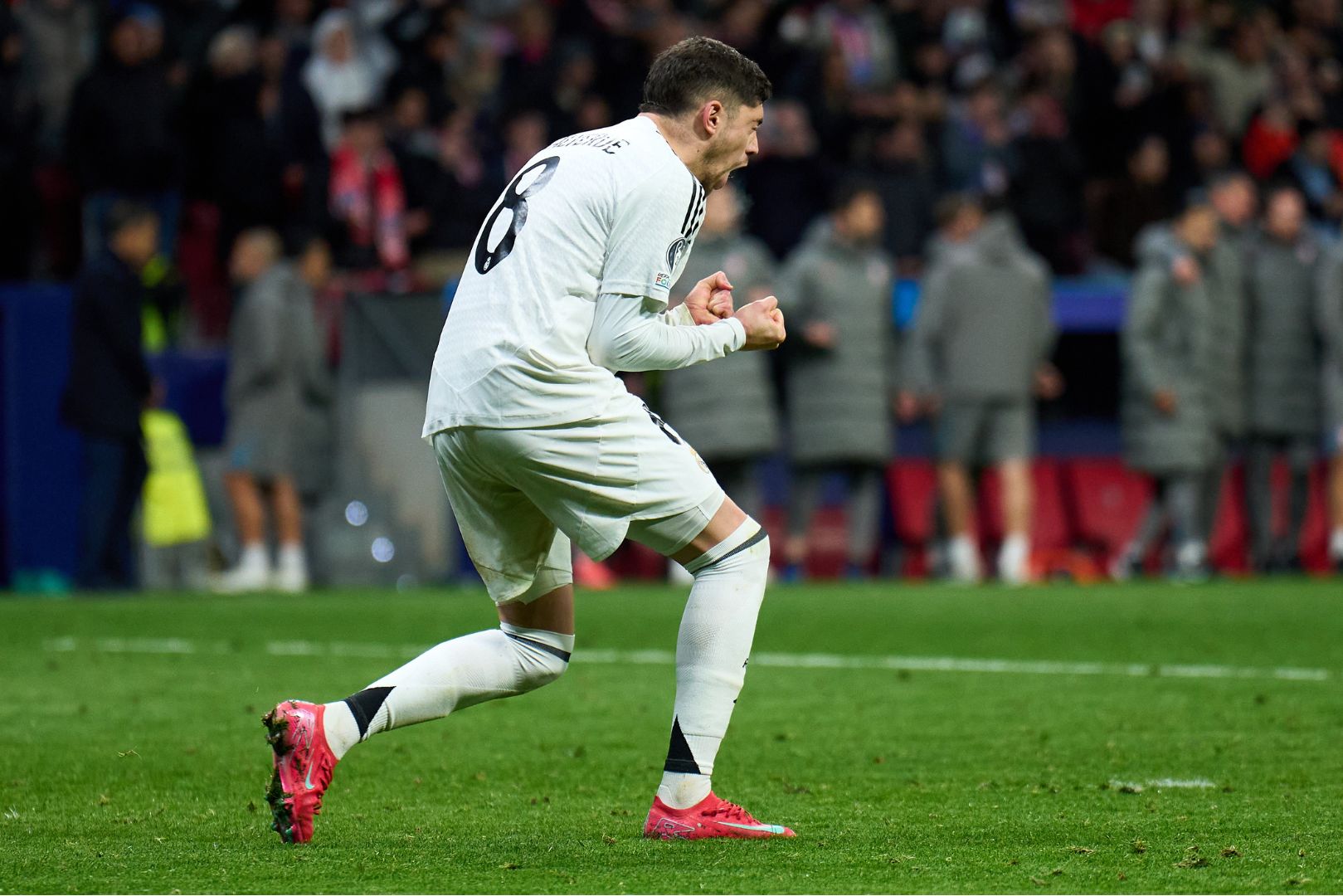 MADRID, SPAIN - MARCH 12: Federico Valverde of Real Madrid celebrates scoring a penalty in the penalty shoot out during the UEFA Champions League 2024/25 UEFA Champions League 2024/25 Round of 16 second leg match between Atletico de Madrid and Real Madrid C.F. at Riyadh Air Metropolitano on March 12, 2025 in Madrid, Spain.