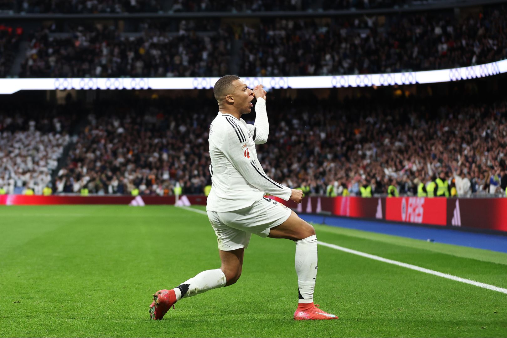 MADRID, SPAIN - MARCH 09: Kylian Mbappe of Real Madrid celebrates scoring his team's first goal during the LaLiga match between Real Madrid CF and Rayo Vallecano at the Estadio Santiago Bernabeu on March 09, 2025 in Madrid, Spain.