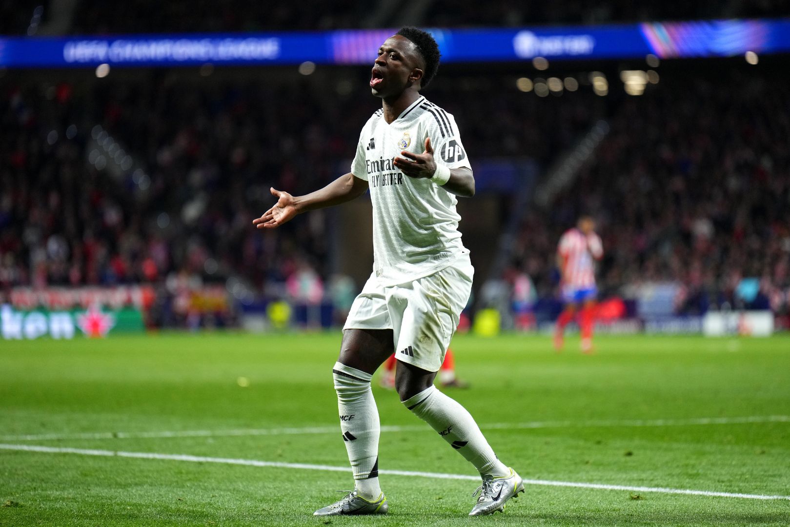 MADRID, SPAIN - MARCH 12: Vinicius Junior of Real Madrid reacts during the UEFA Champions League 2024/25 Round of 16 second leg match between Atletico de Madrid and Real Madrid C.F. at Estadio Metropolitano on March 12, 2025 in Madrid, Spain.